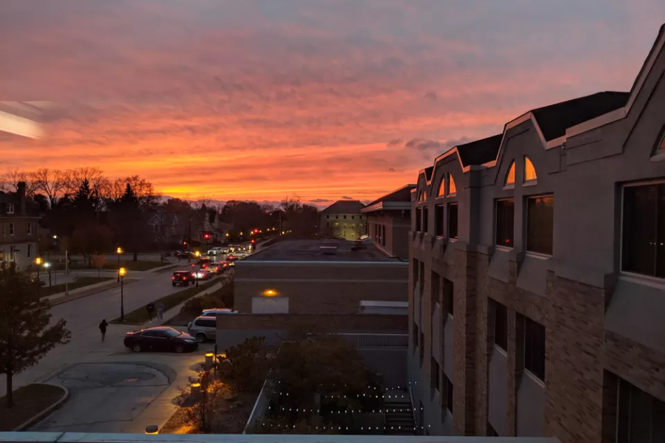 Suburban houses against colorful sunset sky in Waukesha, Wisconsin